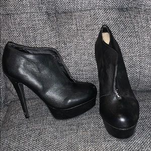 Black platform pumps
